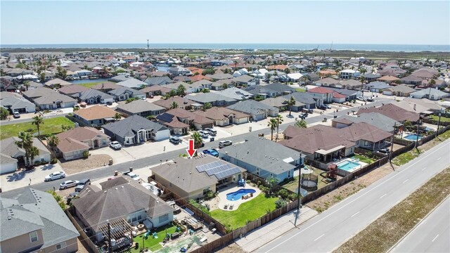 aerial view of residential area featuring a pool