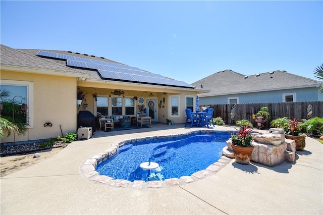 view of pool with outdoor lounge area, a patio, fence, and outdoor dining area