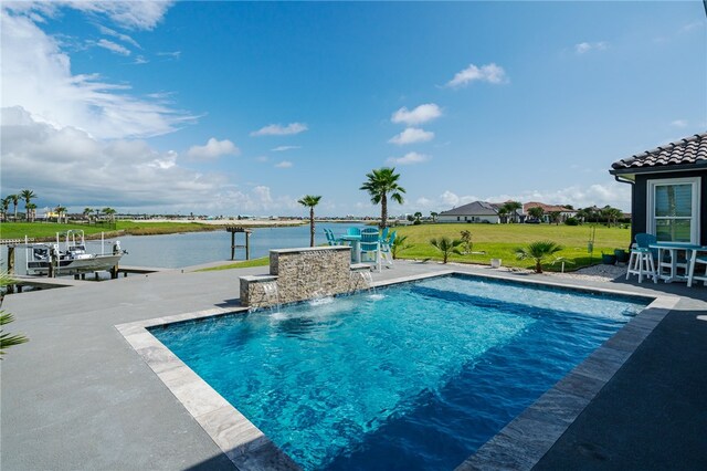 view of swimming pool featuring a water view, a patio, pool water feature, and a dock