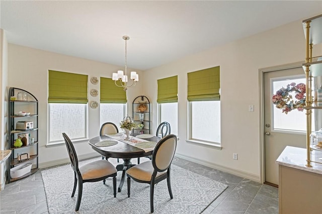 3137 Piranha Dr, Corpus Christi, TX 78414 - dining room featuring a chandelier and baseboards
