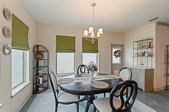 3137 Piranha Dr, Corpus Christi, TX 78414 - dining space with a chandelier and dark stone finish flooring