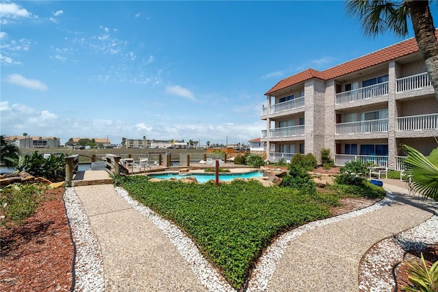 view of property's community featuring a pool