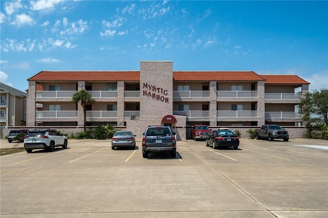 view of property with uncovered parking