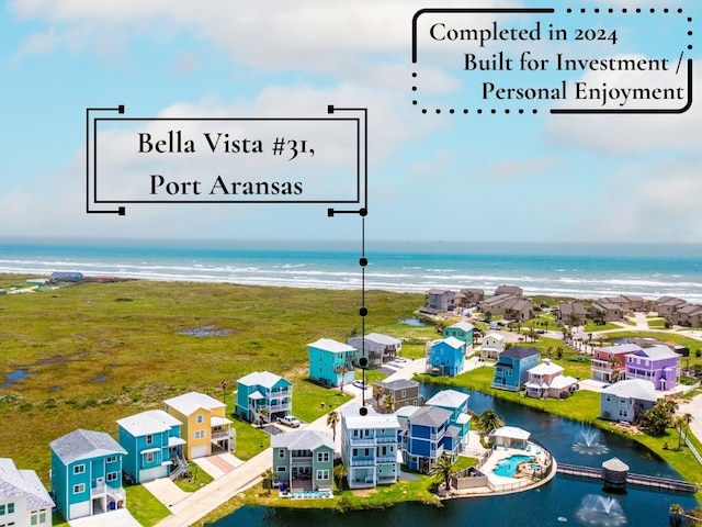 aerial view featuring a beach view and a water view