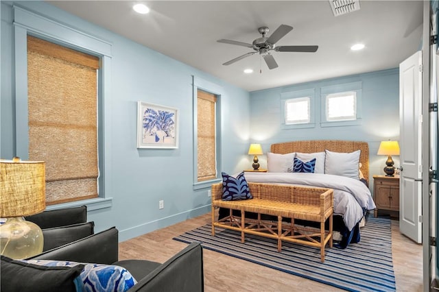 bedroom featuring recessed lighting, visible vents, ceiling fan, wood finished floors, and baseboards