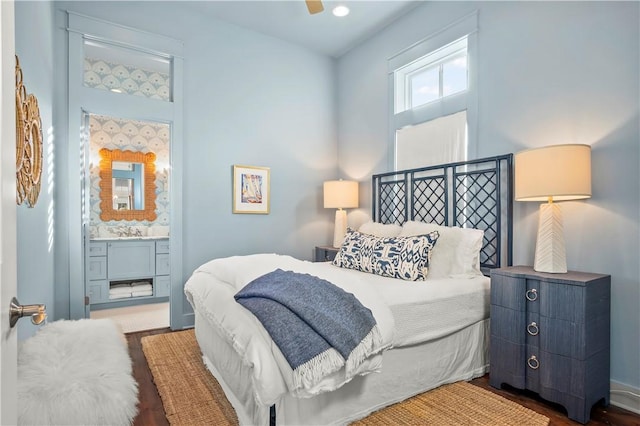 bedroom featuring ceiling fan and ensuite bath