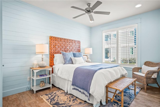 bedroom featuring a ceiling fan and wood finished floors