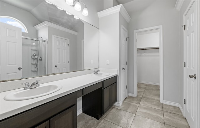 7525 Killebrew Dr, Corpus Christi, TX 78414 - full bathroom featuring a stall shower, double vanity, a spacious closet, tile patterned floors, and lofted ceiling