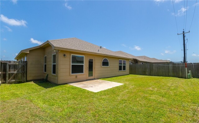 7525 Killebrew Dr, Corpus Christi, TX 78414 - back of property featuring a fenced backyard, a patio area, and roof with shingles
