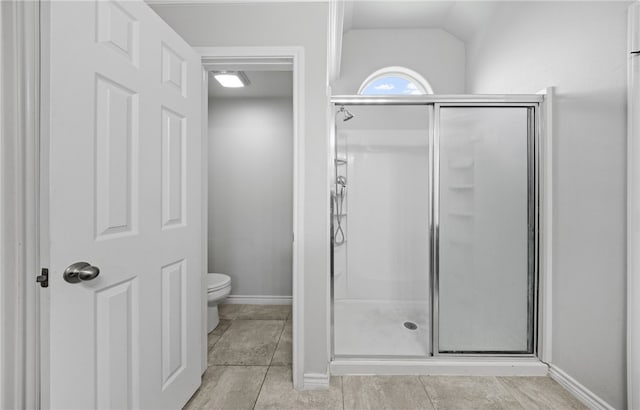 7525 Killebrew Dr, Corpus Christi, TX 78414 - bathroom with a shower stall, tile patterned floors, and vaulted ceiling