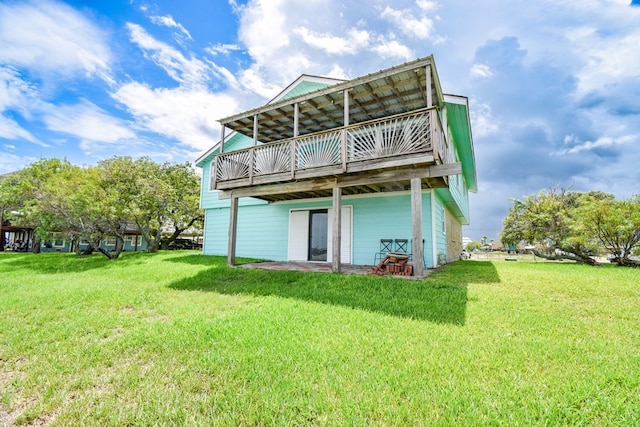 rear view of house with a lawn