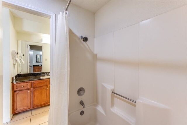 bathroom with vanity, tile patterned floors, and shower / tub combo with curtain