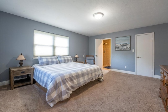 bedroom featuring carpet floors and baseboards