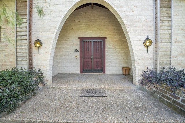 property entrance with brick siding
