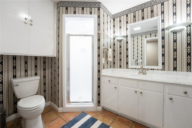 full bathroom with wallpapered walls, a shower stall, tile patterned floors, toilet, and vanity