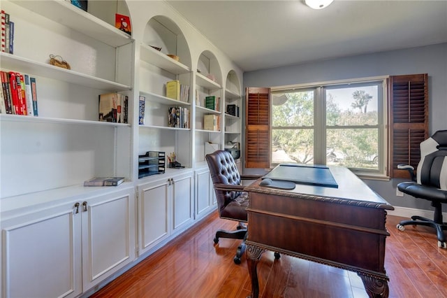 office area with wood finished floors and baseboards