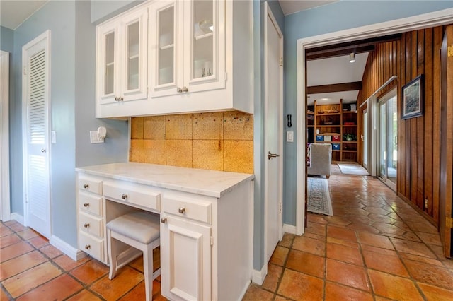 corridor featuring baseboards