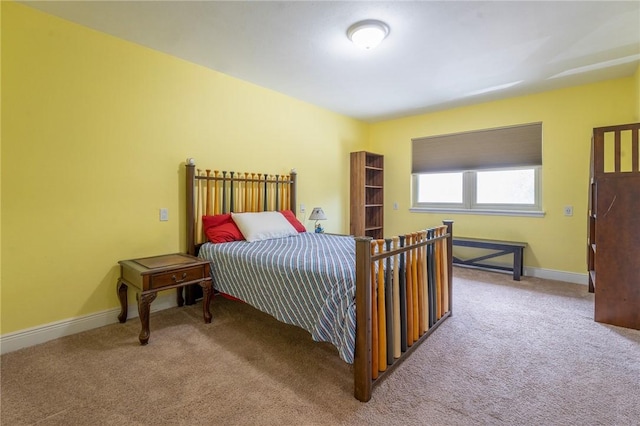 carpeted bedroom with baseboards