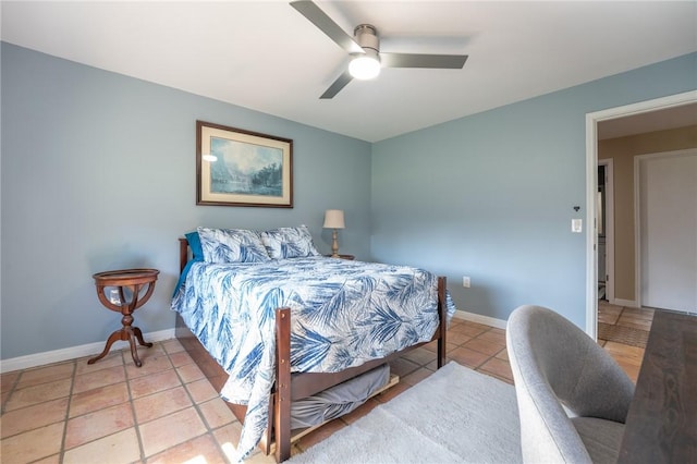 tiled bedroom with baseboards and ceiling fan