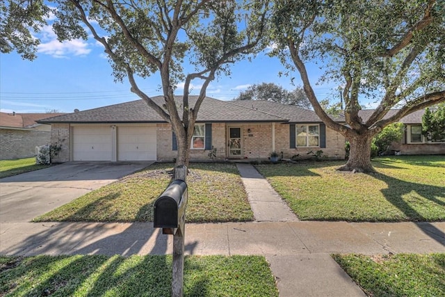 ranch-style home featuring a front yard and a garage