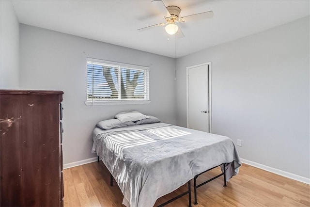 bedroom with ceiling fan and light hardwood / wood-style flooring