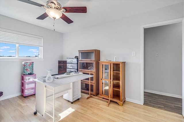 office space featuring light wood-type flooring and ceiling fan