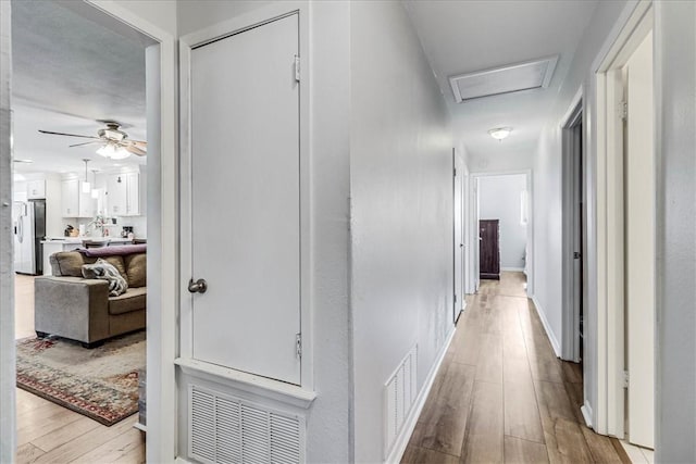 hall featuring light hardwood / wood-style floors