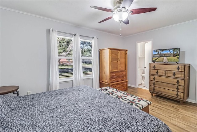 bedroom with wood-type flooring, ensuite bath, ceiling fan, and ornamental molding