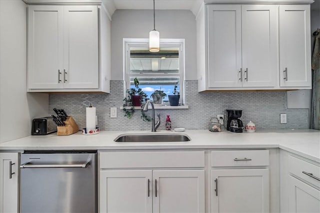 kitchen featuring stainless steel dishwasher and white cabinetry