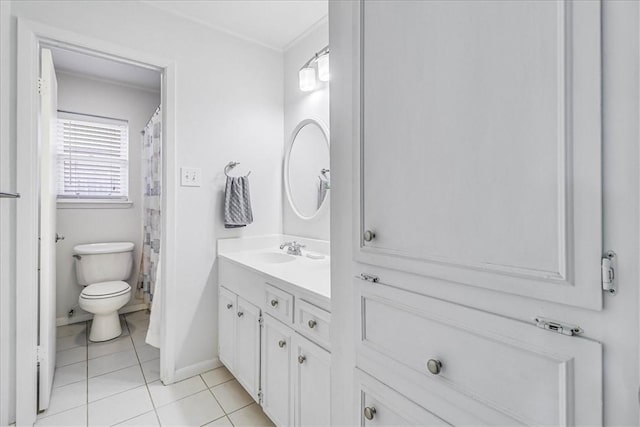 bathroom featuring tile patterned flooring, vanity, and toilet