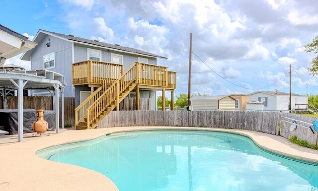 view of swimming pool featuring a deck