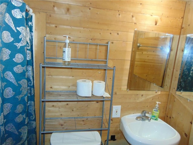 14300 S Padre Island Dr Unit 79, Corpus Christi, TX 78418 - bathroom featuring a sink and wooden walls