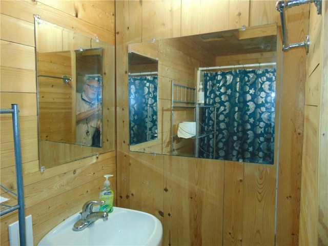 14300 S Padre Island Dr Unit 79, Corpus Christi, TX 78418 - bathroom featuring wood walls and a shower with curtain
