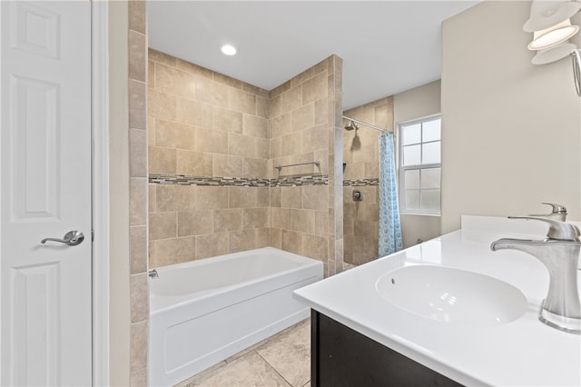 bathroom featuring tile patterned flooring, vanity, and shower / tub combo