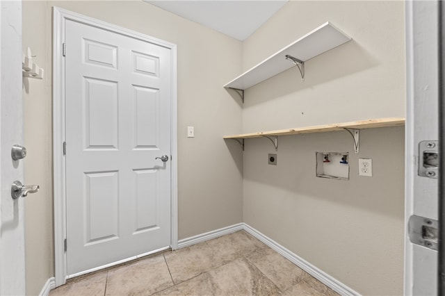 laundry room with washer hookup, electric dryer hookup, and light tile patterned floors