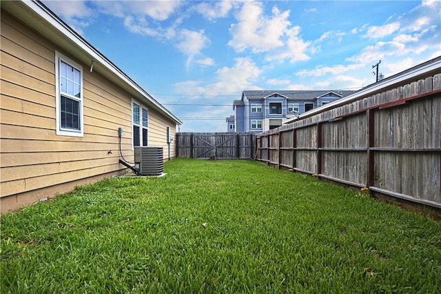 view of yard with central AC unit