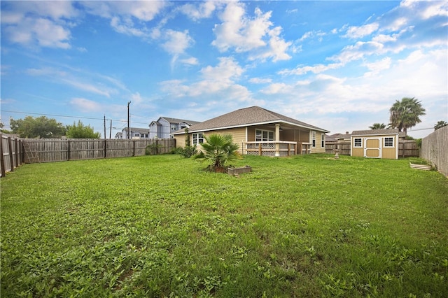 view of yard with a storage unit