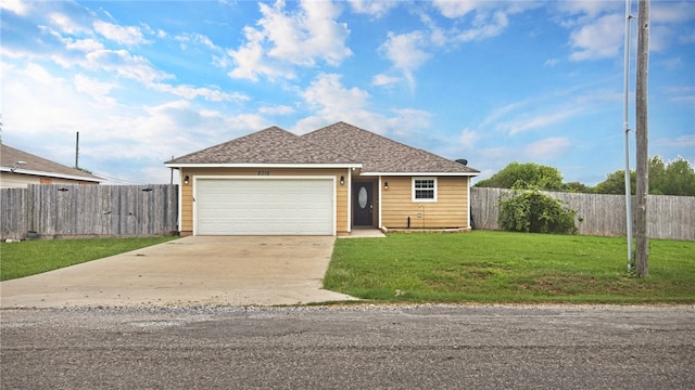 view of front of house with a front lawn and a garage