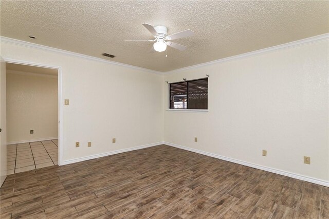 unfurnished bedroom featuring crown molding, light hardwood / wood-style flooring, ceiling fan, a spacious closet, and a closet