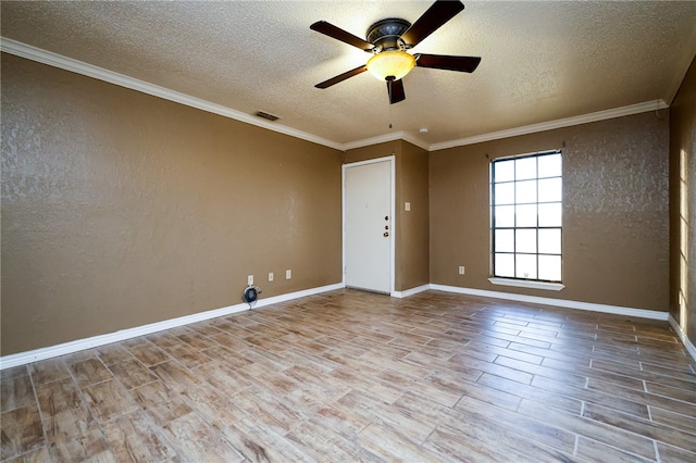 spare room with a textured ceiling, light hardwood / wood-style flooring, ceiling fan, and crown molding