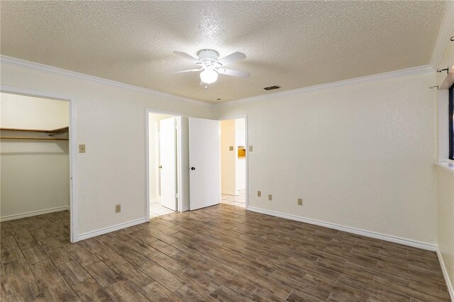 unfurnished bedroom with ceiling fan, light hardwood / wood-style flooring, crown molding, and a textured ceiling