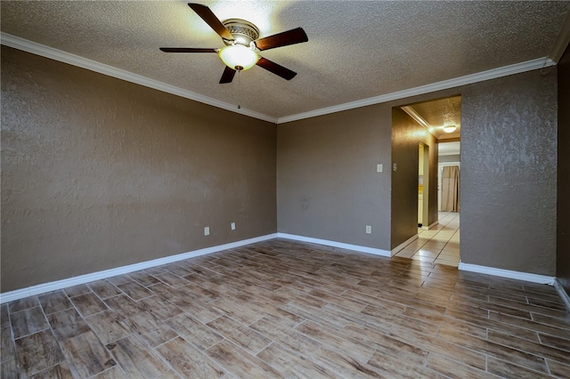 empty room featuring hardwood / wood-style floors, a textured ceiling, ceiling fan, and crown molding