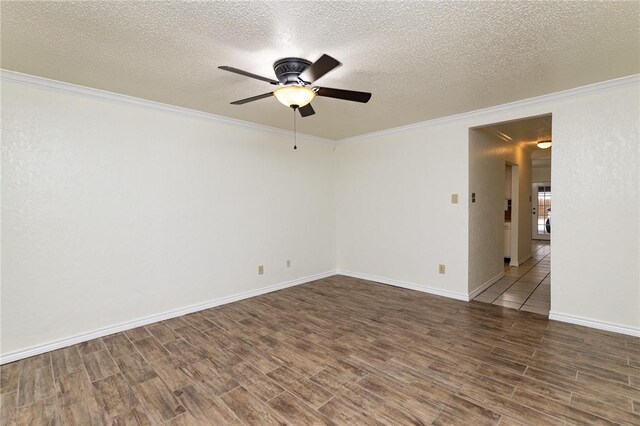 spare room with a chandelier, light tile patterned floors, a textured ceiling, and ornamental molding