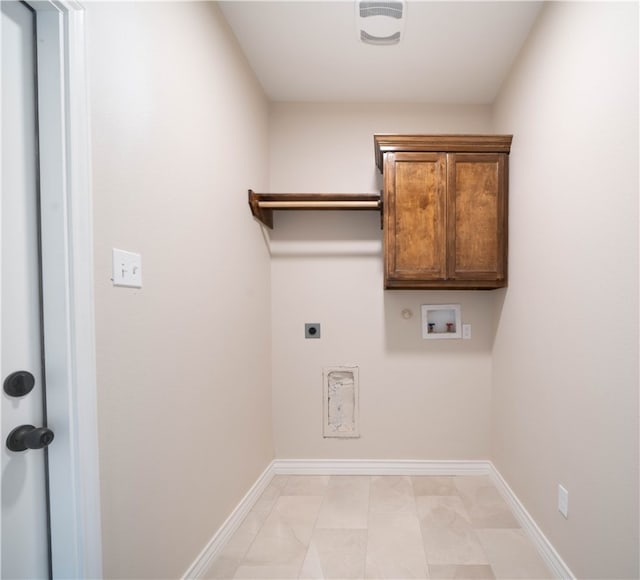 laundry room with washer hookup, electric dryer hookup, cabinets, and gas dryer hookup