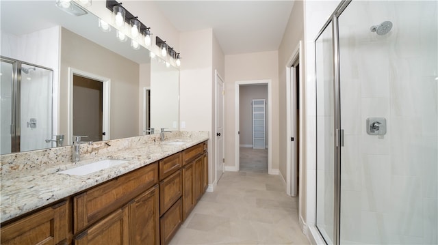 bathroom with vanity and walk in shower