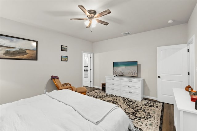 964 Allende St, Seguin, TX 78155 - bedroom with wood finished floors, baseboards, and a ceiling fan