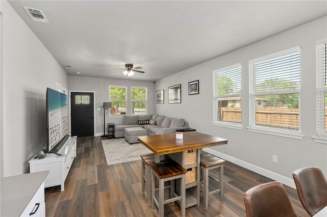 964 Allende St, Seguin, TX 78155 - living room with a ceiling fan, baseboards, and dark wood-type flooring