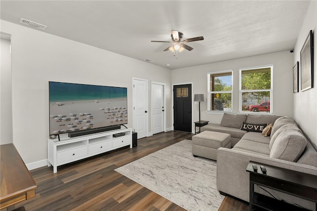 964 Allende St, Seguin, TX 78155 - living area with ceiling fan, dark wood-type flooring, and baseboards