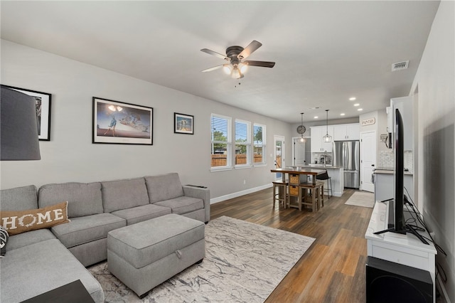 964 Allende St, Seguin, TX 78155 - living room featuring a ceiling fan, dark wood-style floors, recessed lighting, and baseboards