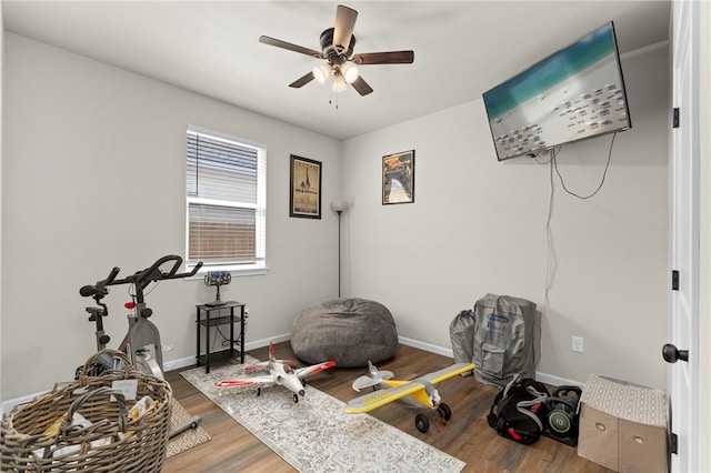 964 Allende St, Seguin, TX 78155 - exercise area with a ceiling fan, wood finished floors, and baseboards